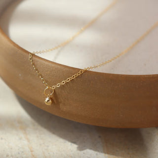 Token Jewelry Golden Globe Necklace